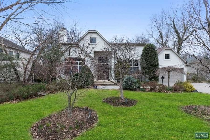 Stunning, totally renovated East Hill Colonial features a grand two story entry foyer, formal living room w/soaring ceiling & fireplace, banquet-sized dining room, sun-lit family room w/fireplace and French doors leading to a stone patio. Oversized eat-in gourmet kitchen features high end appliances. Two Masters, one on each floor. 1st floor boasts Master Suite w/steam shower & whirlpool, elegant private office w/French doors, powder room, mud room & garage. Open second floor with den/loft area, rec room, game room & office area plus 2 bedrooms & 1 full bath and second Master Suite with walk in closet. Home has radiant heat in kitchen, master bath & powder room, dramatic high ceilings throughout, central vac, generator, alarm & underground sprinklers. This generous lot is sized at .52 acres w/beautiful specimen plantings in a prime location. Minutest to NYC! Don't miss this one! A Must See!!!