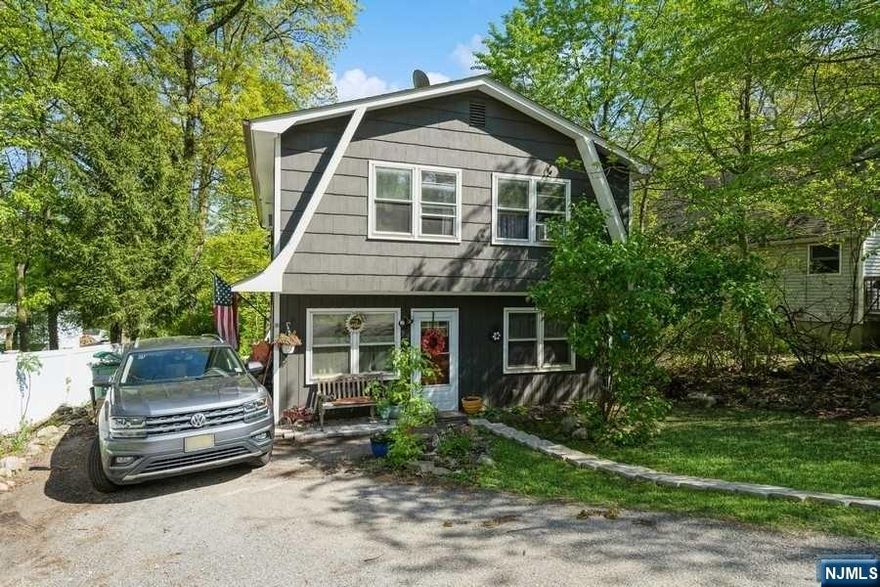 Welcome to this 4 Bed 2 Bath Charming Home. Harwood floors in living and bedrooms. The living room is cozy and comes complete with wood burning stove. The large kitchen offers plenty of cabinet space, granite counter tops, tile floors and an open eat in kitchen concept with sliders that lead out to a nice wood deck where you can overlook the mountain / ski slope. Updated bathrooms and Laundry on main floor. Nice sized yard and Storage shed. This home is conveniently located near schools shopping and recreation.