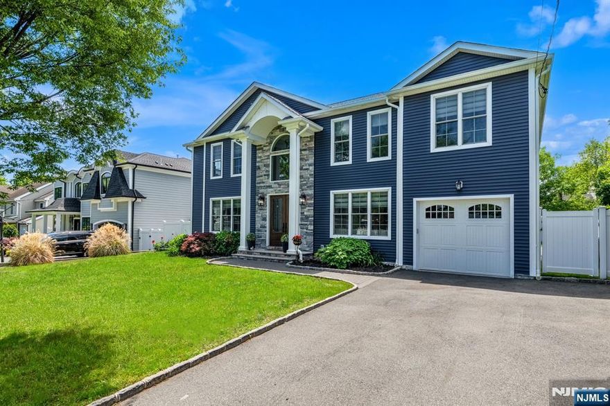 Located on the desirable West Side of Paramus, this custom-built 2021 colonial offers 5 bedrooms, 3 full and 2 half baths, and a spacious, modern layout filled with natural light and high-end finishes throughout. A grand two-story foyer leads to formal living & family rooms, perfect for both entertaining and everyday living. The stunning kitchen is totally open-concept to the breakfast nook and dining room and features JennAir stainless appliances, quartz countertops, ample cabinetry with pantry, and a large center island, ideal for gatherings. Sliding glass doors open to a level, fully fenced backyard. Upstairs, the luxurious primary suite includes a WIC and spa-like bath. 3 additional bedrooms feature custom closets, while a private in-law suite offers a full bath, balcony, & separate entrance. Finished basement offers large rec spaces, a half bath, and generous storage. Deep 2 car garage and a paver driveway complete this exceptional home.