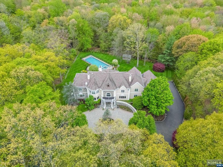 THIS INCREDIBLE MANOR OFFERS EXQUISITE DETAILING & CLASSIC ELEGANCE.BEAUTIFULLY APPOINTED THIS COLONIAL SITS ON 2 PRIVATE ACRES & FEATURES CIRCULAR DRVWY & GRAND ENTRANCE.GLEAMING 2 STY EF & BRIDAL STAIRCASE. LR W/DUAL FPL. BANQUET SIZE FDR,FORMAL LIVING ROOM,SOARING 2 ST. GREAT RM W/FPL & VIEWS OF THE REAR OASIS.FAMILY RM W/BUILT-INS. GOURMET KITCHEN WITH STATE-OF-THE-ART NEW APPL.SUN FILLED BREAKFAST RM SURROUNDED BY WINDOWS OVERLOOKING THE EXCUISITE GROUNDS.HOME OFFICE/DEN, BR EN-SUITE, PR, LAUNDRY RM & ACCESS TO 4 CAR GARAGE COMPLETE THE 1ST FL. 2ND FL INCLUDES ELEGANT OWNERS SUITE W/HUGE WALK-IN CLOSET, LUXE BATH W/JACUZZI, LG SS & SAUNA. LIBRARY W/ IMPRESSIVE BUILT-INS & FPL. 4 BRS EN-SUITES & UNFINISHED BONUS RM. ENORMOUS LWR LVL W/BILLIARD RM, WET BAR, HOME THEATER, GYM, BATH, PLAY AREA & HUGE STORAG RM.NWHOLE HOUSE GENERATOR, GUNITE POOL& SPA ENCOMPASSED BY A BLUESTONE STONE PATIO,PERGOLA,BUILT IN BBQ.& EV CHARGER.TRULY A PLACE TO CALL HOME!!! LOW SADDLE RIVER TAXES.