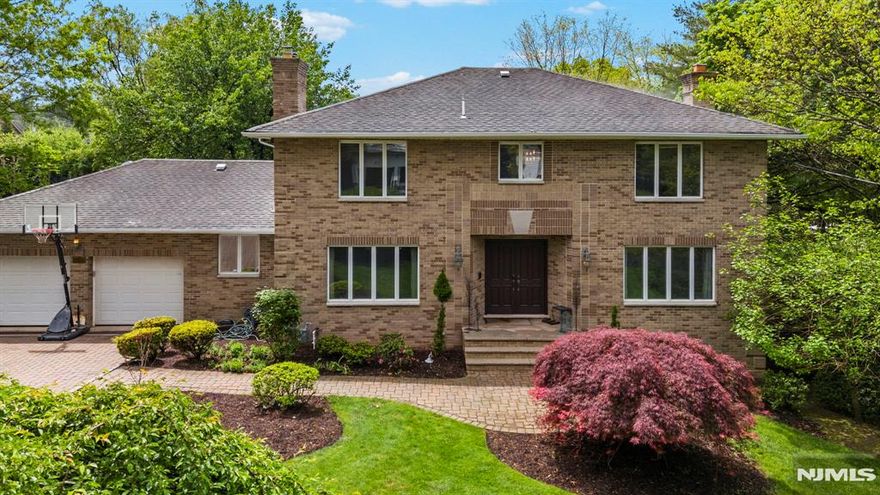 LOCATION LOCATION LOCATION! Tucked away on a highly sought-after cul-de-sac on Closter's East Hill, this beautifully updated 4BR, 4.5BA Center Hall Colonial offers the perfect blend of timeless charm and modern luxury. Situated on 0.38 of property across from Alpine, this stunning home features a gorgeous free form in-ground gunite pool, lush landscaping, and magical outdoor spaces ideal for entertaining. Inside, you'll find a newer chefâ€™s kitchen with top-of-the-line appliances, an elegant formal dining room with french doors, and a spacious family room with fireplace. The main level also includes a refined home office with custom cherry built-insâ€”perfect for todayâ€™s lifestyle. The full finished walkout basement is a true bonus, complete with a SECOND full kitchen, large rec area with fireplace, full bath and direct access to the backyard retreat. Upstairs, you'll find a spacious ensuite, 2 additional bedrooms, full bathroom and a serene primary suite. This is a rare opportunity to own an exceptional home in one of Bergen Countyâ€™s most desirable locationsâ€”just minutes from top-rated schools, shopping, dining, and NYC transportation!