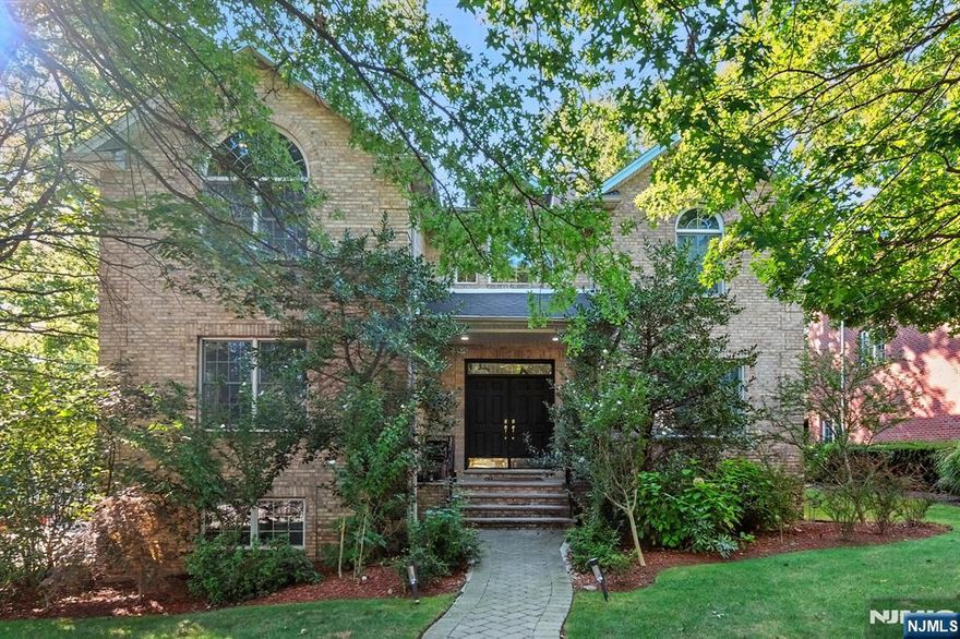 Step into this elegant Englewood Cliffs home featuring a dramatic two-story foyer. The main level offers a formal dining room, a versatile living room, a spacious study with abundant natural light, and an inviting family room with fireplace that opens to a bright, airy kitchen. Upstairs, the layout includes four bedrooms: two sharing a Jack-and-Jill bath, one with its own bath, and a serene primary suite with private bath. The finished lower level provides a large recreation area and an exercise room, perfect for todayâ€™s lifestyle. Located on a quiet cul-de-sac in one of Englewood Cliffsâ€™ most desirable neighborhoods, this home blends comfort and functionality with a sought-after setting.