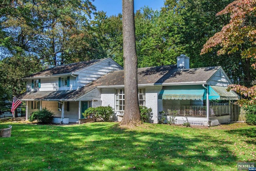 Appealing split level on large well-located property. Updating needed, but great basics. Newer systems, hardwood floors, large bright kitchen, pool and more.