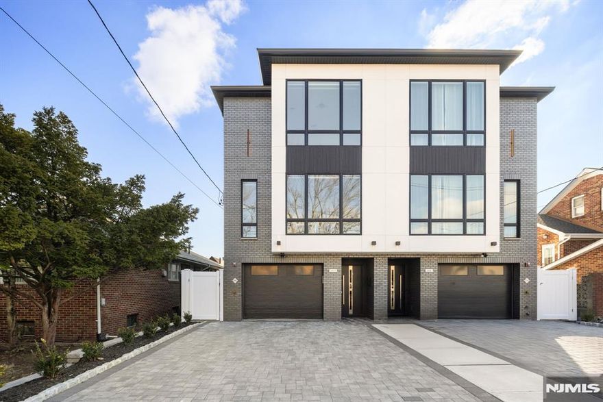 Stylish and modern, this townhome, built in 2024, is located in the most sought-after area of Cliffside Park, offering breathtaking NYC views. Spanning four levels, the home features a rooftop deck with a wet bar and premium contemporary finishes throughout. The entry level highlights an open-concept kitchen with a quartz waterfall island, state-of-the-art appliances, a powder room, and a versatile space that can be used as an office or family room. The home includes 3 generously sized bedrooms, 5 bathrooms, a recreation room on the ground floor, a mudroom, and ample storage. Additional features include a fire sprinkler system, 4-zone heating and cooling, a fireplace, sleek hardwood floors, LED lighting, an oversized garage, and a true 2-car driveway. Ideally situated close to dining, shopping, and grocery stores, the property is just a one-minute walk to NYC express buses.