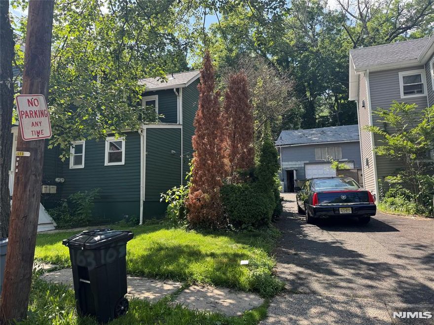 EXTREMELY RARE OPPORTUNITY! This oversized garage is located behind gates moments from the center of town in the heart of South Orange Village. Nestled around mostly residential properties, this large garage could house between 6-10 vehicles as well as ample parking outside within the gates; approximately 20 additional vehicles. Tons of office, storage space, and loft space--this can be a working facility or redeveloped into residential homes. Currently being used as a woodworking shop, it was previously used as a storage facility for a local new car dealership. Grandfathered in to continue current use--this property is also located within the redevelopment zone, moments from NYC train station. The possibilities are endless for what the property can be! It is a stand-alone building (located in the rear of the property) that is around 35 feet by 57 feet on a 0.131-acre lot. The structure has high ceilings and is located in a redevelopment zone on a dead-end street. There is no water supply, air conditioning, or plumbing in the building. There is a wood-burning stove for heating. There is public water, natural gas lines and sewer at the street level.