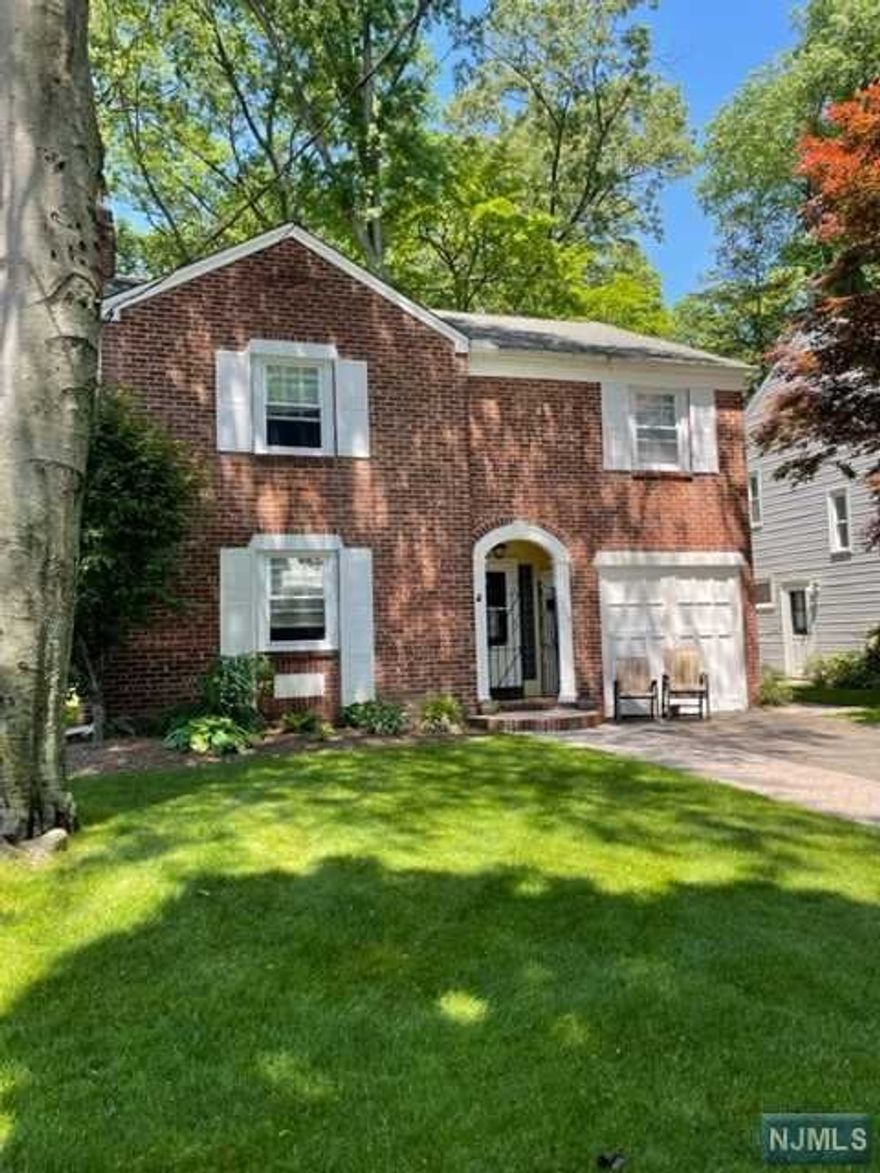 Location,location,location! short distance to nyc bus tran.,schools,stores,houses of worship and parks. This truly immaculate 4 bedroom,2 full,2 half bath col. house features a beautiful renovated eat in kit w sub zero refrig,granite counters,abundance of cabinets,a large lr/fpl,beautufl polished hardwood floors,built in bookcases,formal dining room,office/laundry room and pr on 1st floor. The 2nd fl features a king size primary bedroom w beautiful bth,3 additional all good size bedrooms,and beautiful hall bth,a great finished basemt /playroom w lots of storage space,summer kitchen ,pr,gas heat and central air..a must see