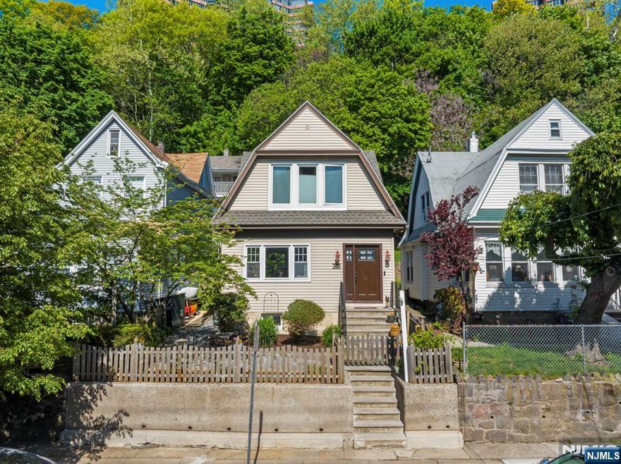 Another Edgewater gem awaits the next loving owner. This meticulously maintained Dutch Colonel house lies on a large 30 x 125"ft lot. Many nice surprises await both inside and out; from the original stained-glass windows inside, to the nature embraced setting, outside. A sunny patio, complete with a birdhouse, greets you as you enter into the property. The house has a foyer w/an interior door, formal dining room, MEIK with a center island, a sliding glass door to the back yard, and solid oak HW floors throughout. Everything has been updated, and/or serviced recently, and it has a 1-year-old roof and mini split AC/Heat systems. The full basement has an additional shower and Bilko doors to the back yard. The back patio is great for relaxing, dining, and entertaining. It even comes with a country-like shed and borders the wooded mountainside. The property also has an â€œEco Friendlyâ€ landscaping design with flowers, plantings, and water erosion control, with gravel walkways, along pavers. Located right in the center of town near worship, EVG school, post office, Trader Joes, Whole Foods, and more.