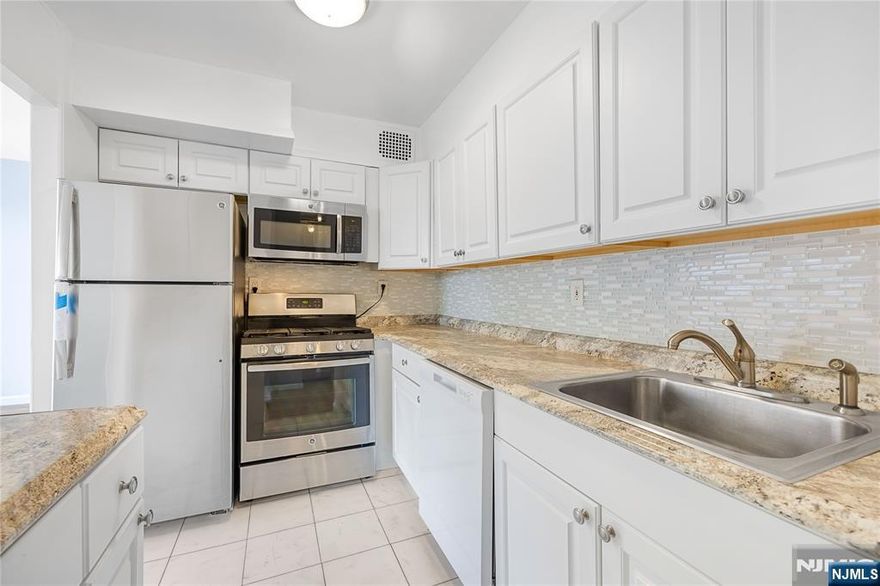 Welcome to Unit 2E at 6050 Boulevard East â€” a spacious, newly renovated residence offering bright and airy living in one of West New Yorkâ€™s most desirable full-service buildings. This beautifully updated home features tall, near floor-to-ceiling windows that flood the space with natural light, creating an open and inviting atmosphere throughout. Enjoy hardwood floors across the entire apartment, a thoughtfully designed enclosed kitchen, abundant closet space, and a recently updated bathroom. The expansive living room is the true highlight â€” offering a wide, open layout perfect for both relaxing and entertaining. The bedroom comfortably fits a king-sized bed with room to spare. Residents enjoy a full suite of amenities, including a pool overlooking the NYC skyline, BBQ grill area, modern fitness center, and 24/7 concierge with security. The HOA of $962.74 covers utilities, full amenity access, front desk services, and one assigned parking space. There is also an additional $205.77 monthly capital improvement assessment. Ideally located for commuters, with NJ Transit bus lines 156, 158, and 159 just steps away, providing a seamless commute to Manhattan in minutes. Close proximity to Boulevard East waterfront parks, local shops, restaurants, cafes, and everything West New York has to offer. A perfect combination of space, light, convenience, and lifestyle.