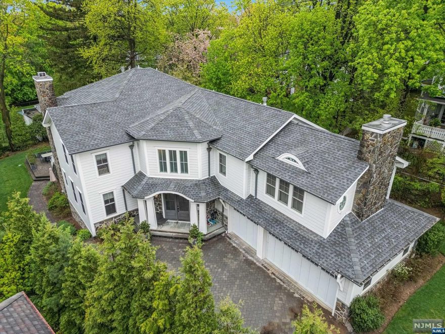 SPECTACTULAR NEW CONSTRUCTION (5 YEARS) IN ENGLEWOOD'S DESIREABLE EAST HILL BOASTING 8000 SQ FT OF LIVING! 1ST FLOOR FEATURES 2 STORY GREAT RM W/ OVERSIZED WINDOWS & STONE FIREPLACE OPEN TO A MAGNIFICENT CHEF'S KITCHEN W/SUB ZERO/WOLF APPLIANCES/MARBLE COUNTERS/2 OVENS/2 DISHWASHERS ETC AND FORMAL BREAKFAST RM. A 1ST FL ENSUITE BEDRM/BATH OFFERS IDEAL SPACE FOR GUESTS. DINING RM W/WET BAR, FORMAL LR/OFFICE, 2 HALF BATH, MUDROOM & 3 CAR GARAGE. THE 2ND LEVEL PRIMARY SUITE FEATURES SITTING RM W/FPLC & WET BAR, A 2ND FPLC IN SLEEPING AREA & HIS/HER CUSTOM WALK-IN CLOSETS, BEAUTIFUL PRIMARY BATH W/ STEAM SHOWER & RADIANT FL. ALSO ON THE 2ND LEVEL; 4 BEDRMS, 2 ENSUITE BED/BATHS & 2 BEDRMS W/JACK & JILL BATH. THE WALKOUT LOWER LEVEL BOASTS A 1000 BOTTLE WINE CELLAR, ENTERTAINERS BAR, MOVIE THEATRE, GYM & FULL BED/BATH + ADDITIONAL FULL BATH. RADIANT HEAT IN ALL BATHS & GENERATOR.