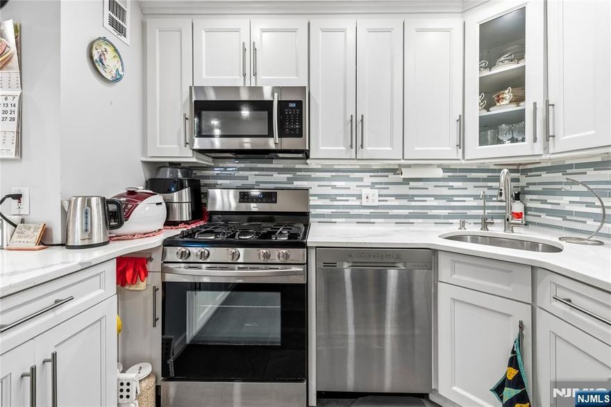 Welcome home to this totally renovated apartment. Hardwood floors, large granite countertop in kitchen with newer appliances, totally renovated baths, huge closet in entry foyer and closets throughout the apartment. This unit offers NYC skyline views and transportation to NYC or ferries at your doorstep. Sit on your terrace and enjoy a bit of suburbia and then when you want more of urban entertainment take the bus or ferry to NYC.