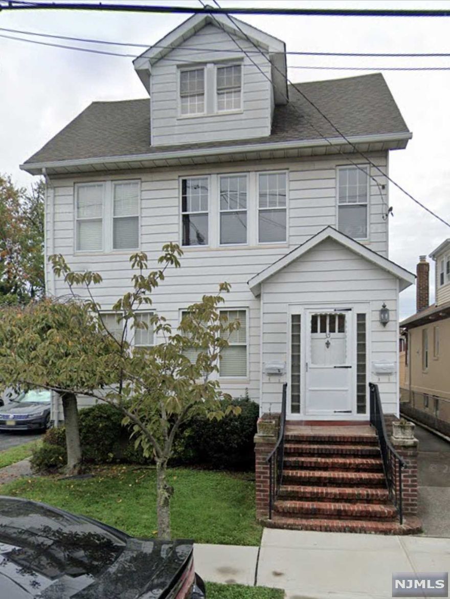 Welcome to Belleville! Beautiful spacious two family home with three car garage.