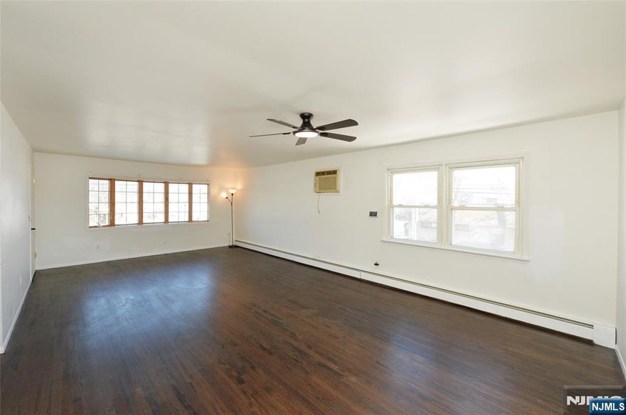 Welcome to this bright and inviting 1st Floor 3-bedroom, 2-full-bath first-floor apartment in Garfield, perfectly located directly across the street from the park. Set within a well-maintained two-family home, this spacious residence offers an ideal blend of comfort, convenience, and modern updates ready for you to move right in. Step inside to find beautiful hardwood floors flowing throughout the home, creating a warm and welcoming atmosphere. The thoughtfully designed layout features two generously sized bedrooms with a full hallway bath, along with a spacious primary suite offering its own private en-suite bathroom for added comfort and privacy. The updated eat-in kitchen showcases new tile flooring and a stylish backsplash, delivering both function and modern appeal perfect for everyday living. The expansive living room and dining area provide plenty of space to relax, work from home, or entertain with ease. With its unbeatable location, spacious layout, and move-in-ready condition, this apartment offers the perfect place to enjoy comfortable, convenient living. Donâ€™t miss this fantastic rental opportunity Apartment includes 1 spot in the driveway.