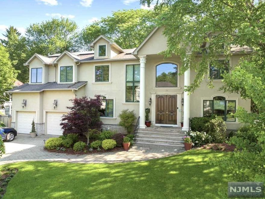 Situated in the East Hill of Closter, this center hall Colonial home has a newly renovated eat-in-kitchen, hardwood floors, and dedicated home office. With a beautiful fenced-in backyard, lush landscaping, newly installed landscape lighting. This energy-efficient home has solar, a full-house generator, and Tesla Charging. 1st fl. is the perfect hosting space w/ powder room. Separate BR and bath adjacent to kitchen. 2nd fl. has oversized landing with 3BRs. JJs and en-suite. The private Main BR is perfect retreat, w/sitting area and 2nd fireplace, 2 California WIC, spa-like Main bath. 2019 renovated basement, addt'l entertaining area, gym, sauna and storage. Close proximity to shopping, parks, hiking, golf courses, award-winning schools and much more!