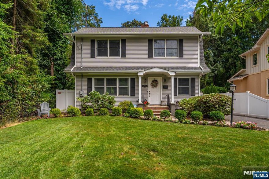 Tucked away in the heart of desirable Pascack Valley, this updated 2021 Colonial blends charm, comfort, and convenience in all the right ways. From the moment you enter, you're greeted by sparkling wood floors and an abundance of natural light that glistens through every room. The living room invites cozy evenings by the gas fireplace, while the dining room opens to a spacious deck perfect for summer BBQs or tranquil morning coffees shaded by a canopy of trees. The kitchen is crisp and functional, and a bright family room adds flexibility for entertaining or relaxing. Upstairs, the primary suite is your personal retreat, complete with its own en suite bathroom. Two additional bedrooms and a stylish common bath round out the second floor. Need more space? Head to the finished basement, where you'll find another hangout-worthy family room, laundry, and plenty of storage -- a space to customize to suit your needs. The fully fenced backyard feels like your own private hideaway with lush greenery and shaded by mature trees. Best of all? You're less than a mile from the Hillsdale train station and vibrant downtown Westwood, making NYC access a breeze. This is the kind of turnkey home that makes moving easy and living even easier!