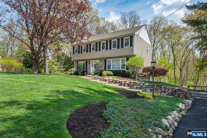 Welcome to this warm and inviting Colonial in the desirable Fardale section of Mahwah. This well-maintained and thoughtfully updated home has been lovingly cared for and is ready for its new owners to move right in. There are beautiful hardwood floors, recessed lighting, and crown molding on the first floor. The large LR is open to the DR and Kitchen, with stainless steel appliances, abundant custom cabinetry, and a large center island w/pendant lights and seating for 4. A cozy Family Room with fireplace leads to the 3-season screened porch. Laundry and a half-bath complete the first floor. Upstairs there are four BR's, including a Primary BR Suite, and hall bath. The basement features a finished Rec Room with sliding door out to a covered patio. The screened porch and wood deck are the ideal spots for your morning coffee or evening relaxation, offering serene wooded views. This coveted Fardale neighborhood is conveniently located near shopping, restaurants, and 3 rail stations in neighboring Ramsey, Wyckoff and Allendale. Close to major highways. Mahwah is known as Bergen's Parkland, with skiing, golf, hiking trails and Darlington County Park. Low taxes and highly-regarded schools are added bonuses! The property has a canine electric fence for Fido, too!