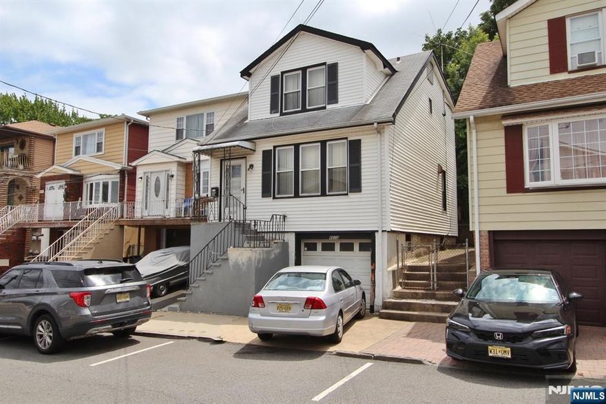 Nestled in North Bergen with a convenient location near major bus lines and light rail access, this home offers both practicality and potential. The first level welcomes you with a flowing layout that includes a spacious living room, formal dining room, and kitchen. Upstairs, youâ€™ll find three well-proportioned bedrooms and a full bathroom. The basement level adds bonus flexibility with a utility room, laundry area, and direct access to the attached garage. Off-street parking is a true asset here, with both a driveway and garage included. Sitting on a deep 25x100 lot in an R1 zone, this property presents future development possibilities â€” including potential for a two-family home (subject to local approvals). The extended backyard provides ample room for outdoor use or future expansion.This property is being sold strictly "AS IS"- seller will not do work or offer any credits. Buyer responsible for all municipal certificates and interior content removal. Short Sale-subject to third party approval