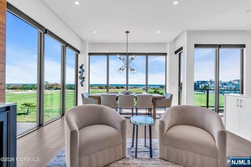 Panoramic ocean views await in this one-of-a-kind, 4-level townhome with over 3,100 sq. ft. of beautifully designed space all with panoramic views. This home offers a private elevator, 5 bedrooms & 5 full baths. A dramatic glass staircase with an Arctic White stone feature wall, sun-filled living areas showcase a walnut media wall and floor-to-ceiling panels of glass. The designer kitchen is equipped with top-tier appliances, quartz surfaces, and designer custom cabinetry. Upstairs, a private rooftop retreat steals the show with a built-in grill, firepit and breathtaking views of the Atlantic--perfect for unforgettable entertaining or quiet moments by the ocean.