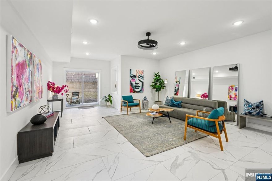 Eligible for a 5-year tax abatement and a special interest rate program with 5.375% (no PMI) and only 5% down, this home offers an incredible opportunity to experience the best of modern city living. Nestled in the vibrant Jersey City Heights neighborhood, 78 Beacon Ave presents over 2000 square feet, stunning 4-bedroom, 2.5-bathroom new construction condo that perfectly blends modern design with everyday comfort â€” complete with a private yard. Upon entry, youâ€™re welcomed into an open-concept living and dining area filled with natural light from an expansive wall of windows, porcelain tile, creating a bright and inviting atmosphere ideal for relaxing or entertaining. The modern European style kitchen features a sleek quartz waterfall island, stainless steel appliances, ample storage, and sophisticated finishes making it a true centerpiece for all gatherings. The lower level provides exceptional versatility, featuring a fourth bedroom and full bathroom â€” perfect for guests or extended family or an au pair. The upper-level features hardwood floors and offers three spacious bedrooms and two full bathrooms, including a serene primary suite with a spa-like en-suite bath featuring a glass-enclosed shower and contemporary fixtures. Additional highlights include in-unit laundry for everyday convenience and plenty of closet space for all your storage needs. Located in JC Heights, residents enjoy access to an array of local shops, trendy restaurants, parks, and transportation opt