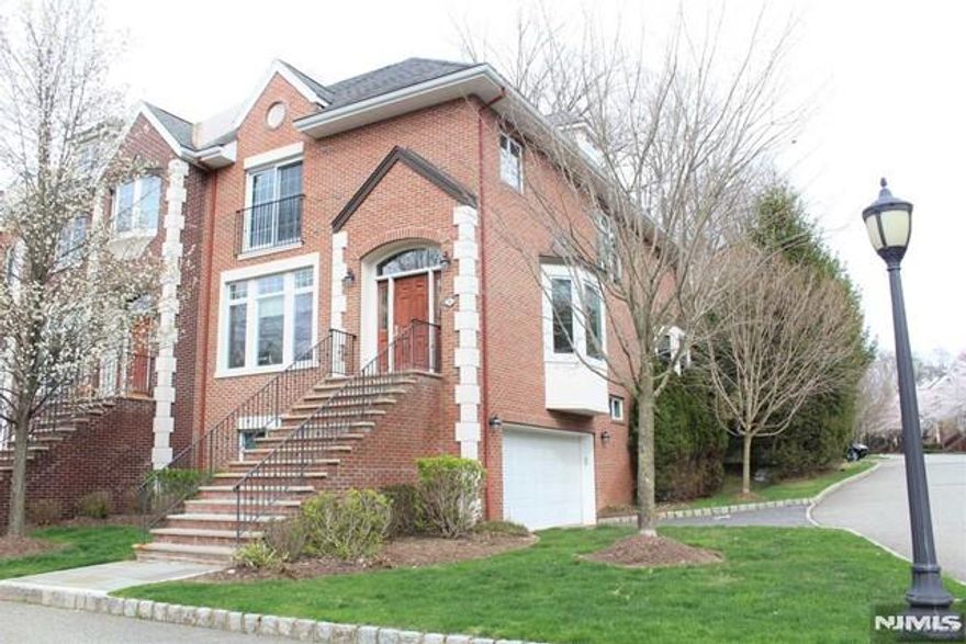 Welcome to this beautiful townhouse in Dorotockey's Run in Old Tappan. This bright and spacious end unit offers 3 bedrooms and 3.5 baths with hardwood floors throughout. The main floor features an inviting foyer that opens to the living room and dining room, along with a gourmet kitchen that opens to a family gathering area with a fireplace and a sliding glass door leading to the deck. The primary suite includes a fireplace, sitting area, two walk-in closets, and a luxurious primary bath. Two additional bedrooms and a full bath complete the upper level. The lower level features a family room, a full bath, and a sliding glass door that opens to the patio-perfect for additional living space or entertaining. Conveniently located across from the Old Tappan Golf Course and within a highly regarded school district. Donâ€™t miss this opportunityâ€”schedule your visit today!