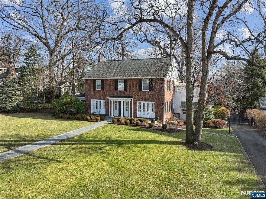 Experience timeless elegance in this stunning Classic Colonial, nestled on Glen Ridge's most prestigious street just minutes from NYC trains and some of the nation's top-rated schools. This exquisite 11-room brick home offers 6 spacious bedrooms, 3 full and 2 half baths, seamlessly blending historic charm with modern sophistication. From its gleaming hardwood floors and original moldings to its newly designed, spa-like baths, every detail has been thoughtfully updated for today's discerning homeowner. Step outside to a sprawling backyard large enough to accommodate a luxurious pool or transform into the ultimate soccer and lacrosse field. A rare opportunity to own a meticulously updated masterpiece in an unbeatable location!