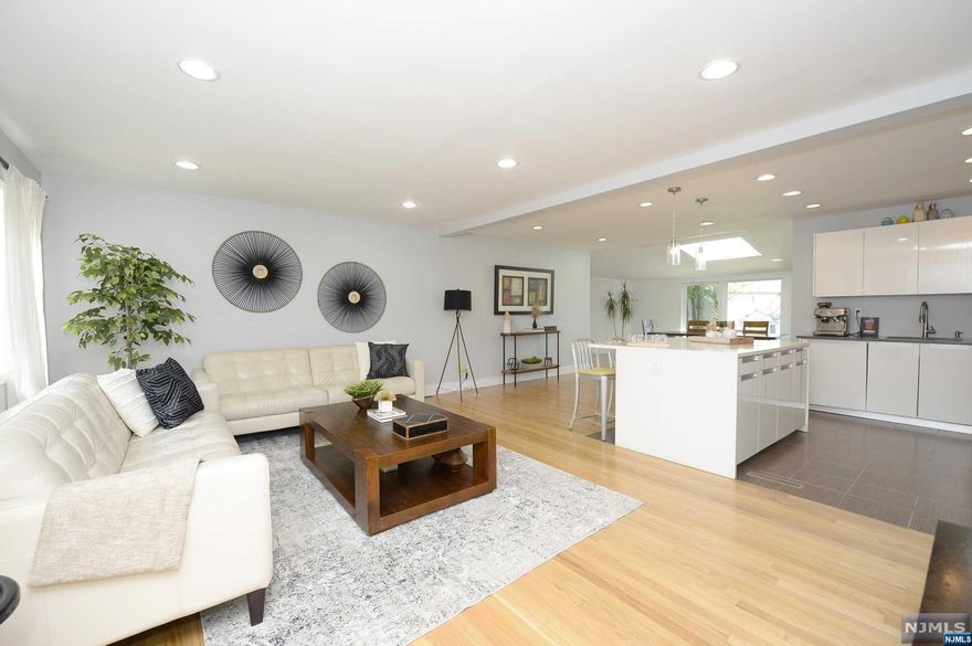 Step inside this stunning 4 bedroom 2 full bathroom Cape Cod house in the desirable Fair Lawn area near Cresthill Playground and close to the Radburn Area. With a whopping 2120 square feet, this open and sun-filled home is sure to impress. The first floor, spanning 1304 square feet, features an inviting entry foyer, a spacious living room, a modern kitchen with updated appliances, a formal dining room with a skylight that floods the space with natural light, and a family room with a full wall of windows that leads to a beautifully landscaped yard and deck. The first floor also boasts 2 large bedrooms, full bathroom, and plenty of storage space. The second floor features an additional 2 bedrooms, one of which has a den attached, and a full bathroom. As an added bonus, the basement is fully finished, offering additional living space, and a brand new 75 Gallon Water Heater and a new heating system. Don't miss out on the opportunity to make this your dream home.