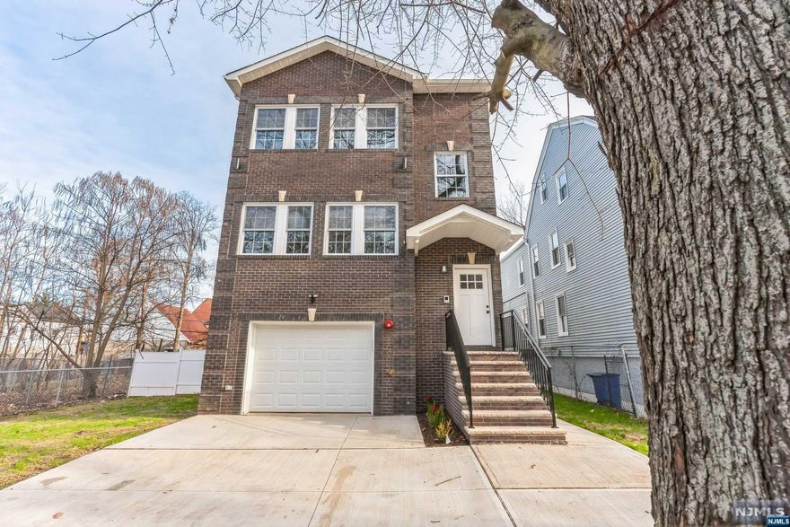 Welcome!!!!! BRAND NEW HOME, large, two-family home has everything you are looking for and is sitting on one of the large lots in the neighborhood. Featuring: First floor 'Open Floor Plan. 'with, Living & Dining room, kitchen with quartz countertops Center island, three bedrooms, and two full baths, Interior stairs connecting to the lower-level Recreation room, Half Bath, High ceilings, Crown moldings and recessed lighting, hardwood floors throughout except for kitchens baths and rec room tiled floor, Exterior Brick front, vinyl siding, Driveway, Garage, vinyl fence-in spacious backyard,