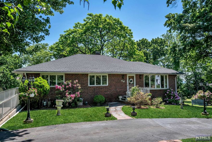 Opportunity knocks at this lovingly cared for solid brick construction ranch on a near half acre lot. Offering the best of one level living with even a wheelchair ramp, this house has generous room sizes and a nice layout. The main level features a large living room & eat-in kitchen, 3 bedrooms & two full baths including a primary suite. The walk-out lower level has a wonderful finished recreation room with large bar & built-in banquette, home office & laundry/storage. Large property with patio, shed & circular driveway. Central air. Bring your design ideas!