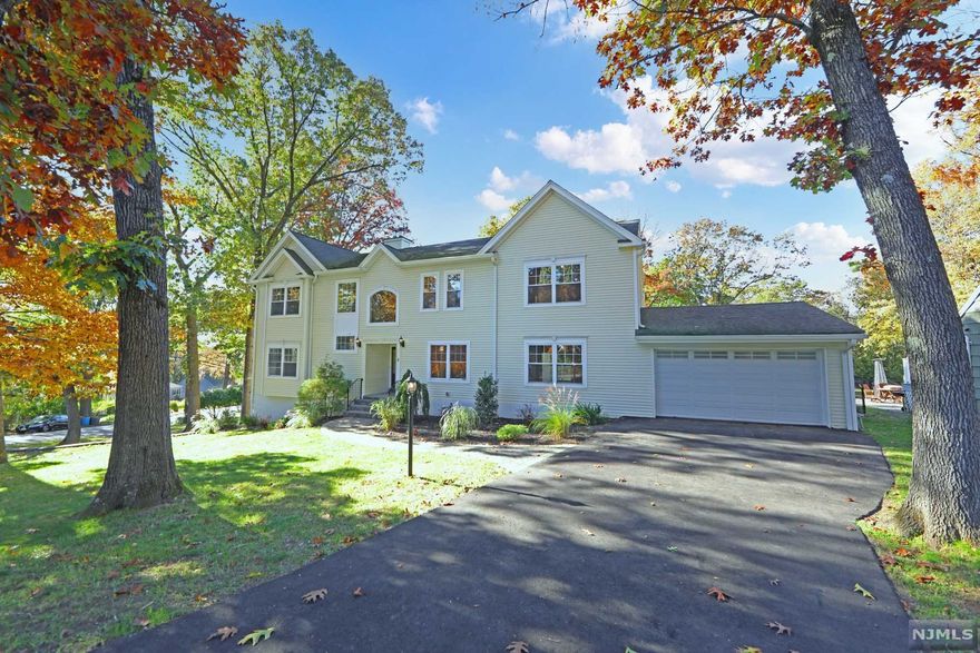 Welcome to 4,000 sq ft of Gut renovated bliss! This corner lot features tons of symmetrical windows, TWO driveways, an oversized 2 car garage, and a stunning backyard! Situated in a very desirable neighborhood, this 4 bedroom 4 FULL bathroom home comes with an incredible finished basement and a master TO DIE FOR! The kitchen is straight out of a magazine with Viking Appliances, portrait windows, & Quartz countertops with a custom marble backsplash. The drop-down family room has a covered patio leading to an incredible yard. The master bedroom has his & her closets, a vaulted ceiling, a private covered deck, double vanity, fully enclosed shower, and an oversized soaking tub with another private portrait window with scenic views. The full ceiling height finished basement has a stunning Marble fireplace and a door leading to a side yard for private entertaining. This house is 4,000 sq ft plus another 1,150 sq ft in the basement. Be sure to make an appointment today before it's gone!