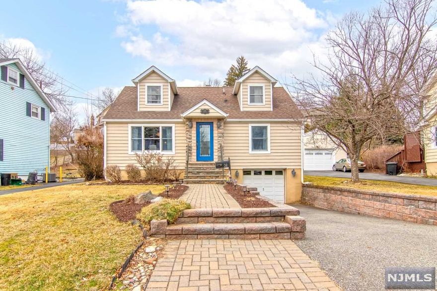 Welcome to this light, bright perfect gem in desirable Verona! Four bedrooms, 2 1/2 bathrooms, an extra room for an office space or walk-in closet, beautiful quartzite countertops in an open-plan kitchen/dining room. Fabulous family room with vaulted ceilings and windows looking out onto your own private outdoor paradise. French doors to lovely deck and gorgeous fenced backyard. Huge glorious master bedroom with walk-in closet! Finished basement with wood stove. Two-zone heating & central air-conditioning. New windows throughout. Attached garage with entrance through basement. This property is minutes to Laning Avenue Elementary school, close to Montclair, Whole Foods, shopping centers, movie theaters and more. Move-in and enjoy all that Verona has to offer: fabulous Verona Park, shops and restaurants, proximity to New York City!