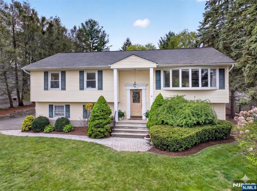 Welcome to Ramsey! Set on a surprisingly large property, this beautifully maintained home offers the backyard everyone dreams of. Inside, youâ€™ll find gleaming hardwood floors, abundant natural light, and an inviting living room that opens to the dining room for an easy entertaining flow. The kitchen features granite countertops, stainless steel appliances, and warm cherry cabinetry, with access to a massive deck overlooking the private yard. Down the hall is a primary suite with walk-in closet and full bath, along with two additional spacious bedrooms and an updated hall bath. The lower level offers a stunning fireplace, expansive family/rec room, newly updated full bath, laundry, and sliders to the yard, plus easy potential for a 4th bedroom if needed. The backyard is truly special, with room to play, run, entertain, and enjoy the newly updated in-ground pool. Close to Ramseyâ€™s charming downtown, top-rated schools, and easy NYC transportation. ****CORRECT 2025 TAXES ARE $14,563*** - WANT MORE INFO? CONTACT LISTING AGENT NICOLE MINETTI @ 201-388-0077 //nicole@minettidennisgroup.com