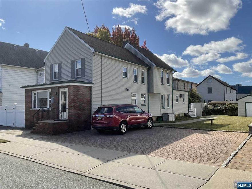 IMMACULANTE MOVE IN READY 2 FAMILY THAT SITS ON A 50X100 LOT WITH TAXES UNDER $10K. THIS HOME IS MOVE IN READY WITH VINYL SIDING, LARGE COMPOSITE DECK, ALL PAVER DRIVEWAY, LANDSCAPED BACK YARD. THE FIRST FLOOR HAS LIVING ROOM, MODERN EAT IN KITCHEN, FULL BATH, LARGE DINING ROOM AND LARGE BEDROOM AND A LARGE ALL COMPOSITE DECK. THE SECOND FLOOR HAS A LIVING ROOM, MODERN EAT IN KITCHEN, FULL BATH AND 2 BEDROOMS. THE BASEMENT IS FULL SEMI FINISHED. THE HOME IS HEATED BY OIL AND THE TANK IS UNDERGROUND IN THE DRIVEWAY. THERE IS SEPARATE ELECTRIC AND SEPARATE COOKING GAS.