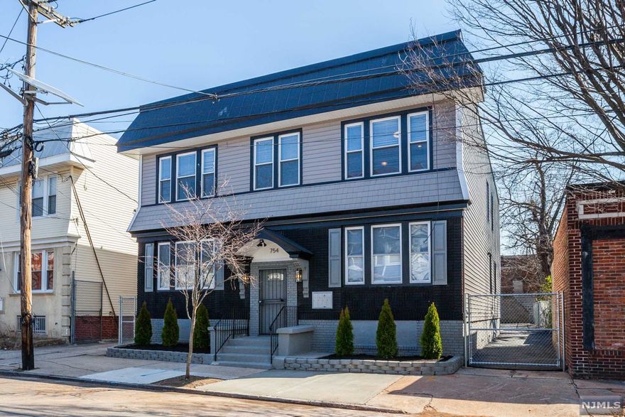 Excellent investment property with a potential monthly rental income of $10,000. Each unit beautifully renovated, with quarts counters and marble backsplash, stainless steel appliances in the kitchen, modern hardware, recess lighting and hardwood floors thru out. There are two units per floor, one - 3BRs /1Bth and one - 4BRs/1Bth. Private driveway w/8 off street parking spots, the potential to collect $100ea per month. Separate Utilities, Full unfinished basement. Close to major highways, schools, parks and minutes from thriving central & downtown area.