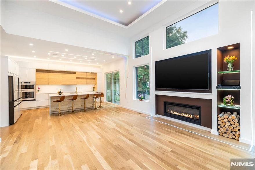 Open House: Sunday 1pm-3pm Modern Sanctuary of Light and Design. Newly constructed architectural masterpiece blending cutting-edge design with timeless elegance. 5BD/5.5BTH across 4 levels and ~4,200+ sft, including a striking Primary Suite, 2 Junior Suites, and a fully independent lower-level unit with private entranceâ€”ideal for multigenerational living, work-from-home flexibility or hosting. Soaring 10 ft and 14 ft ceilings, sun-filled interiors, and a signature LED art installation that responds to mood and music create a living experience thatâ€™s both dynamic and serene. Open layouts make entertaining effortless, while adaptable zones offer space for wellness, remote work, and relaxation. Features include: Balcony, Radiant heated floors in Primary bath, Revolutionary bathing solutions, Built-in speakers, Video surveillance system, Induction cooktop (with natural gas option), Double driveway for 6 cars. Designed differently. Lived beautifully. Now offered at an exceptional value. $$$$$ For showings or questions reach out directly to the listing agent - Denis Rosenberg.