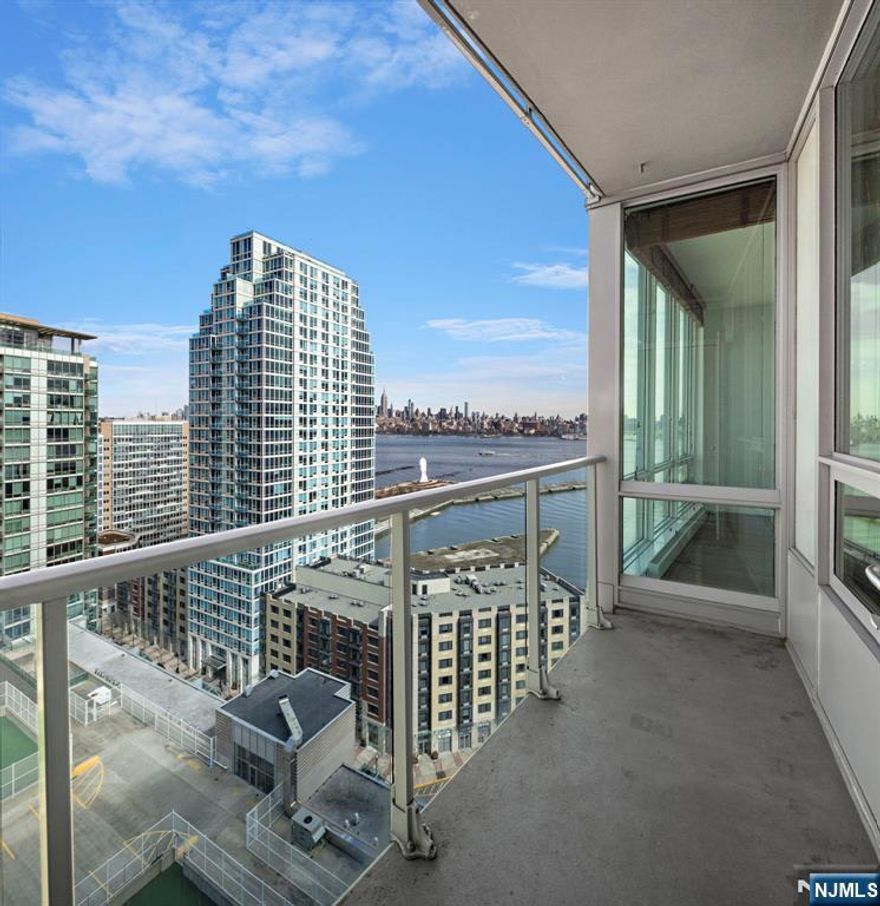 Amazing 2 bed, 2 bath with private balcony and stunning NYC/River views in the luxury community of the Shore Club! Chefâ€™s kitchen includes stainless steel appliances, granite countertops and a breakfast bar. The primary bedroom features a walk-in-closet and a large ensuite bath with a double vanity, shower, and soaking tub. Also included are floor-to-ceiling windows, hardwood floors, in-unit washer/dryer, and central A/C. The luxury community offers 24/7 concierge, a roof top deck and lounge with stunning NYC/River views, conference room, jacuzzi, steam room, sauna, exercise room, and a playroom. Conveniently located near Hoboken & Newport PATH, Morton Williams Supermarket, and mall. Parking is available for an additional fee.