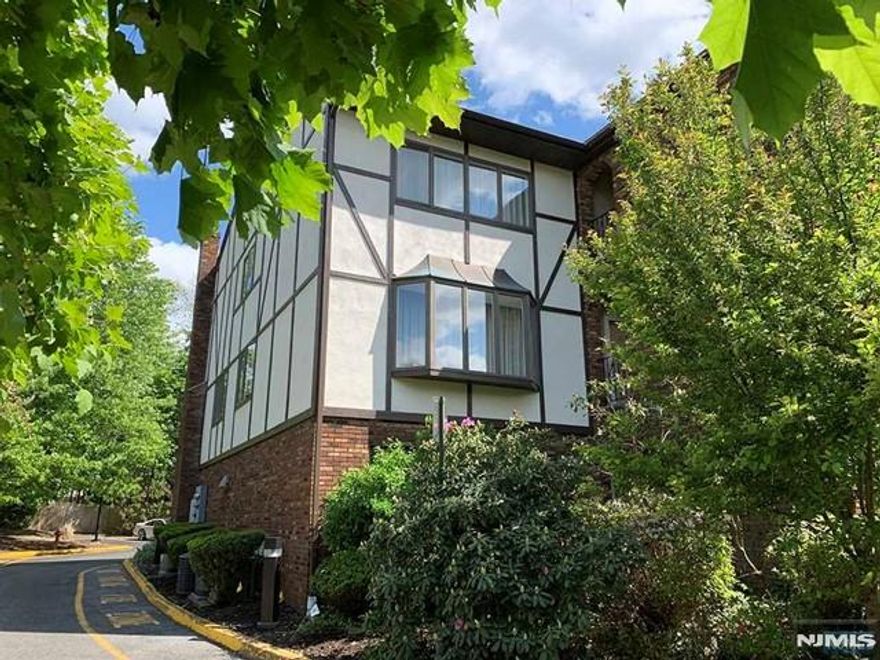 This large and sun-filled 3-bedroom townhome is ideally located just a short walk from both the bus stop and the train to Manhattan. Enjoy unmatched convenience with nearby shops, restaurants, major highways, parks, and local amenities all within minutes. Nestled in a well-known community surrounded by lush landscaping, this home features an open floor plan and generously sized rooms throughout. The main level offers a bright living room overlooking a massive dining area, an oversized family room with a wood-burning fireplace, and a beautifully updated kitchen with new cabinets, granite countertops, and stainless steel appliances. The tastefully renovated bathrooms add a modern touch. The private primary suite includes its own full bathroom and walk in closet, while the ground-level bonus room is perfect for a home office, guest room, or recreation space. A 2-car garage plus 2 additional outdoor parking spaces provide ample parking. Move-in ready, this townhome combines comfort, space, and an unbeatable location. A must-see!