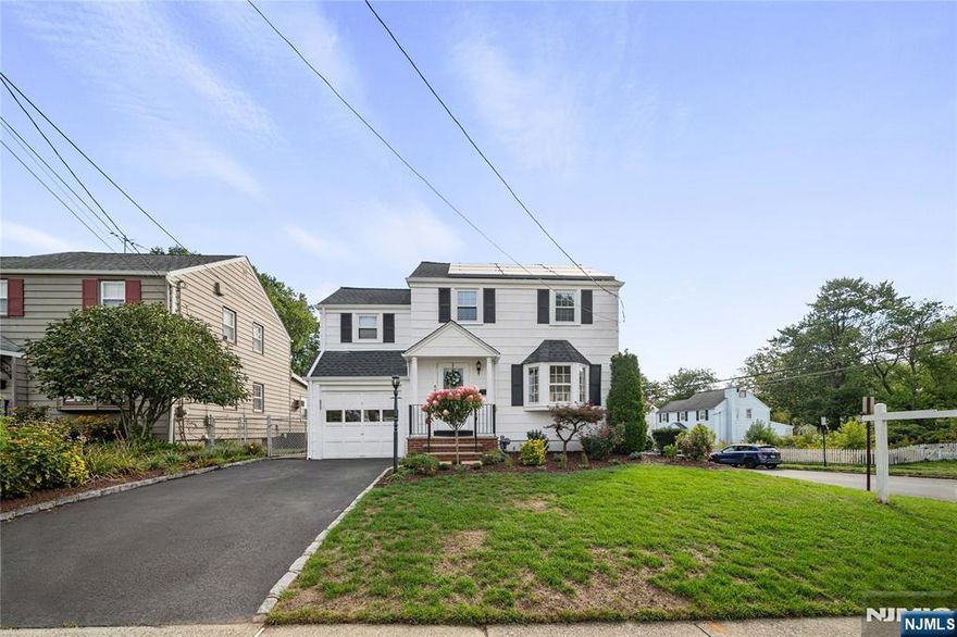 Welcome to this charming 3-bedroom, 1.5-bath Colonial on a desirable corner lot in Bloomfield's Oak View neighborhood. This home blends classic character with modern updates, including a new roof (2022) and solar panels for energy efficiency. The sunny living room with bay window flows into a formal dining room, while the updated kitchen with stainless steel appliances opens to a fenced backyard with patio, sprinkler system, and bonus sunroom perfect for relaxing or entertaining. Upstairs offers three comfortable bedrooms and a renovated full bath with linen closet. The finished lower level adds versatility with a den/home office, updated half bath, laundry, and storage. Additional highlights include hardwood floors, central air (2019), updated electrical panel (2016), newer gutters, and an attached garage with driveway parking. Conveniently located near Oak View Elementary, Brookdale Park, shopping, dining, and NYC transit, this move-in ready Colonial offers neighborhood charm, commuter convenience, and energy savings. Don't miss it!