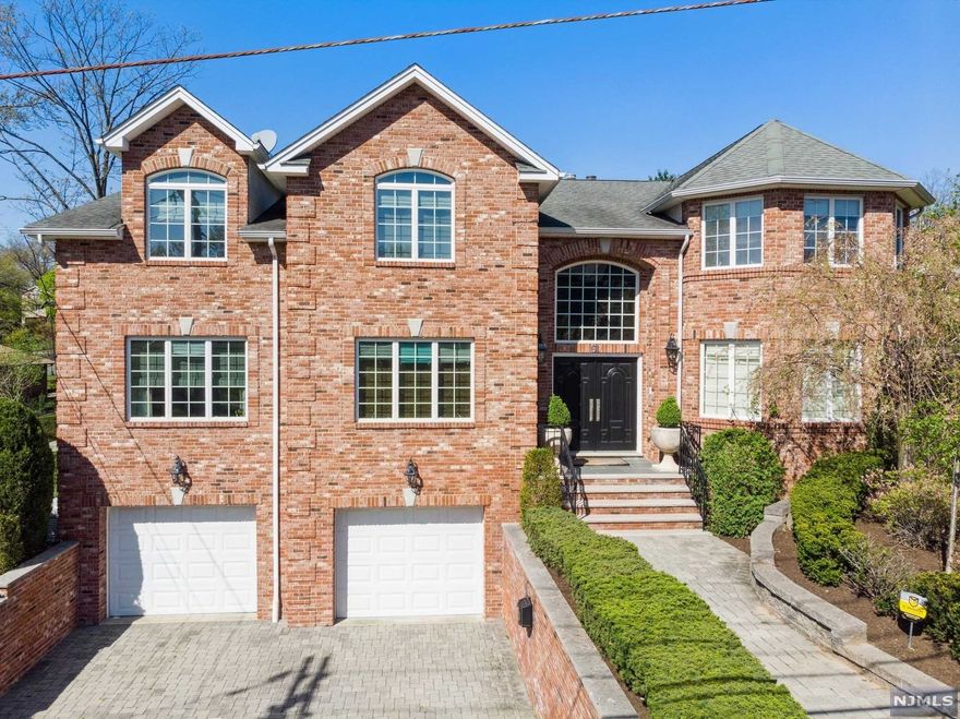This All brick masterpiece will take your breath away. The two story entry foyer sets the stage as you enter the home. The open layout with an over abundance of natural light is evident in every room. A marble entry foyer extends to hardwood floors throughout the home. The gourmet kitchen with custom cabinets, stainless steel appliances and granite countertops overlooks the large great room. A large master suite with spa bath is the focal point upstairs. 3 additional bedrooms and 2 designer baths complete this level. Entertaining says it all about the backyard which includes a large patio and rolling lawn in an overall bucolic setting. This home is perfection minutes from NYC.