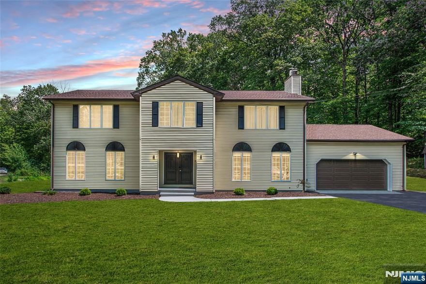 Welcome home to this beautiful newly RENOVATED 4 bedroom 2.5 bath colonial situated on a private 2AC lot with brand NEW roof!! Home offers 2 car garage and beautiful in ground Gunite pool! Main level features open entry foyer, powder room, laundry room, large living room w/ an abundance amount of natural sunlight, family room w/ fireplace, dining room and updated eat in kitchen featuring SS appliances, breakfast bar and sliders out to a relaxing Sunroom! Upstairs offers 4 bedrooms and 2 full bathrooms with bonus space for a sitting area, office etc. Primary suite features an ensuite bathroom w/ shower, separate soaking tub and large walk in closet! Huge basement for lots of storage/rec use. Walk outside to the gorgeous oasis of the in ground gunite pool and plenty of grass area for additional usage surrounded by private woods! This is a MUST see!!!