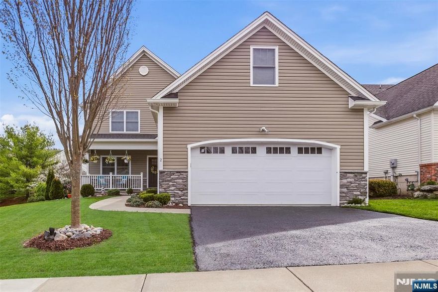Welcome to The Bluffs at Ballyowen in highly desirable Hamburg, where elevated design meets effortless luxury living. This exceptional 2019 builder's model home delivers the perfect blend of sophistication, comfort, and low-maintenance convenience that today's buyers are actively searching for. A sun-drenched open floorplan showcases gleaming hardwood floors and a dramatic family room centered around a striking corner gas fireplace, seamlessly flowing to a rear deck with scenic, tranquil views. The designer kitchen impresses with granite countertops, upgraded backsplash, and sleek black stainless steel appliances perfectly suited for both everyday living and upscale entertaining. The highly sought-after first-floor primary suite offers privacy and ease, while the second level features three spacious bedrooms with walk-in closets and a Jack and Jill bath. The fully finished basement adds approximately 1,000 sq ft of versatile living space, complete with egress windows, a powder room, and rough plumbing for a future full bath. Enjoy resort-style amenities including a heated saltwater pool, plus lawn care and snow removal for true turnkey living. With public utilities and natural gas, this home checks every box. The photos only begin to tell the story this is one you need to experience in person to truly appreciate. USDA Eligible for $0 Down Payment Loan Program!
