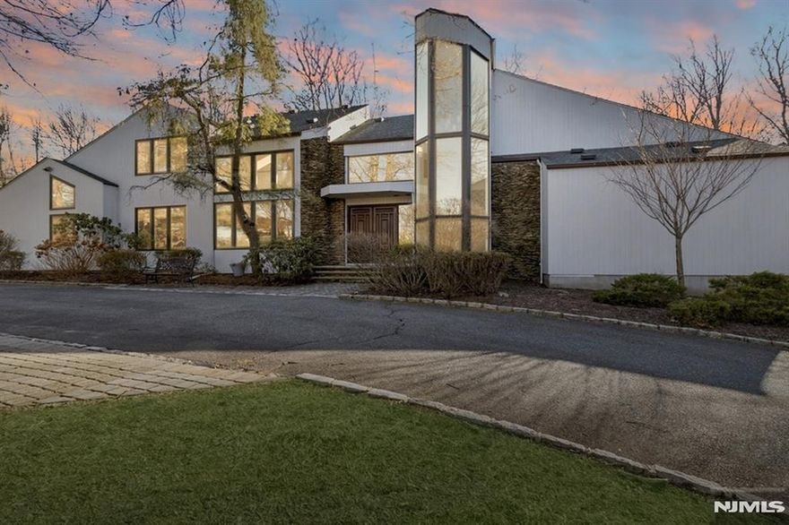 TRUE RESORT on LUSH .57 acres with Beautiful In-Ground Swimming POOL and Summer Kitchen. Part of THE SUMMIT, a Prestigious Community of Custom Homes, this SPACIOUS Forever-In-Demand CONTEMPORARY featuring over 5500 sq ft of Living Space incl Finished Basement. Known for its GREAT ROOM with CATHEDRAL Ceiling and Tons of NATURAL LIGHT with SOARING 2-Story FOYER, Oversized Windows and 2nd Floor BRIDGE with a perfect Birds Eye View of GREAT ROOM, Dining Room and Built-In Bar, perfect for entertaining! Eat-In Kitchen with CENTER ISLAND and DESIGNER Appliances is open to a Cozy Family Room. Main Level 950+ sq ft MASTER EN-SUITE includes NEW HGTV Spa-Like Bath w/ SOAKING TUB, Double Vanity and 2 WALK-IN Closets + Sitting Room w/Walk-out to HEATED PATIO. PRIVATE Office/Bedroom #5 is located on the far side of the main level includes a Full Bath, perfect for POOL use. 2nd floor Loft Space + 3 Bedrooms and RENOVATED 2.5 Bathrooms. FINISHED BASEMENT incl Rec Rm, Exercise/Bonus Rm & Full Bath.