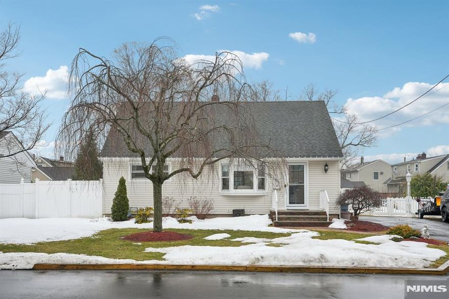 Welcome home to this beautifully maintained 3 bedroom 2 bathroom Cape Cod nestled on a quiet residential street in the heart of Wayne. Step into the inviting living room featuring a large picture window offering a bright and comfortable atmosphere perfect for effortless entertaining or everyday relaxation. Large cased opening leads into the dining room offering an elegant space for enjoying intimate meals or hosting lively gatherings. The dining room flows seamlessly into the kitchen featuring custom cabinetry, ample counter space, appliances and access to the backyard and basement. Sliding glass doors from the dining room lead out to the three season room featuring vaulted ceilings, skylights and windows all around allowing the outdoors in. Two bedrooms and a full bathroom complete the level. Retreat upstairs to discover the primary bedroom suite featuring custom built ins, a generous closet, bonus living space and full bathroom complete the level. Retreat downstairs to the full partially finished basement featuring a comfortable family room featuring a bar, perfect for hosting game nights, movie nights or just relaxing. Step outside from the 3 season room to find the rear deck, ideal for grilling, entertaining and al fresco dining. The rear deck leads into the fully fenced in backyard where you can enjoy all of your favorite outdoor activities and creating backyard memories. Located near NYC transportation, within walking distance of the bus stop, shopping and dining.