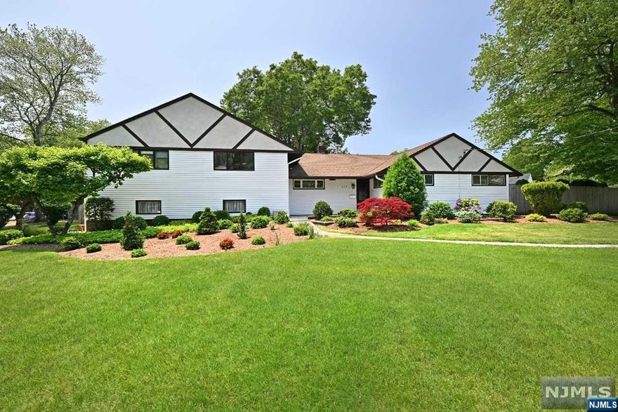 Amazing Curb Appeal for this Expanded & Desirable Tandy Allen Ranch Style home offering a private setting on nearly 1/2 acre of beautiful park-like property! This meticulous 5 Bedroom, 3 Full Bath Home is turn-key! Gracious open floor plan with updated granite kitchen. A genuine wood-burning dual fireplace opens to the living room and dining room! Primary Suite offers 4 spacious closets and updated primary bath with stall shower! Main floor continues with 2 addt'l bedrooms & full bath. A few steps up from the kitchen is the bright & very spacious family room which leads to an addt'l full bath and the 4th and 5th bedrooms. Over-sized two car garage offers laundry area and storage area with access to the immense basement offering rec room, incredible storage space & utility room. Resort-like rear yard is fully fenced offering a beautiful inground salt water heated pool, patio with electric awning and lush specimen plantings! Whole house generator. STUNNING HOME!