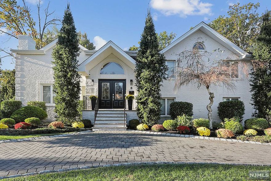 MOVE RIGHT IN! Beautifully renovated North Cliffs Contemporary with Saltwater Pool set on a cul-de-sac street in walking distance to NYC transportation. Recent renovations (2015 to 2020) include: kitchen and bathrooms, roof, windows, skylights, gutters, circular paver driveway, pool, deck, patio, mature landscaping, HVAC, camera security system, and more... The Main level has an open layout with many high ceilings and skylights. The Gourmet Kitchen is adjacent to a large Family Room with a cathedral ceiling, fireplace, wet-bar and sliders to the rear deck which overlooks the luxurious rear property and pool. The Gourmet Kitchen includes a Wolf stove, top of the line appliances, a center island with counter seating and a large breakfast area with sliders to rear deck. The second floor features 3 Bedrooms and 2 renovated baths. The third floor boasts a large Primary Suite with modern bathroom and 2 walk-in closets. Ground level entertainment room with pool bathroom and outside exit.