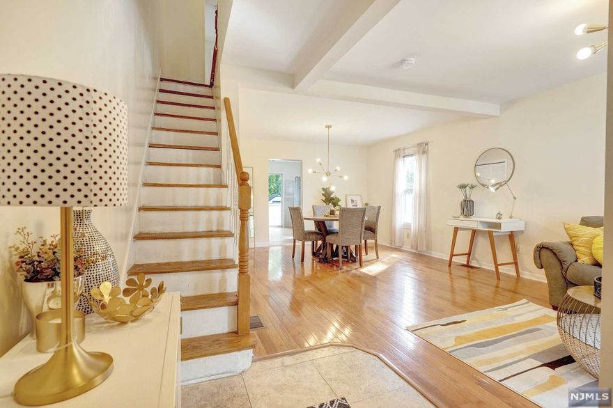 Come fall in love with this delightful 3-bed/2-bath charmer in Montclair's thriving South End! Looking for a 1st home or downsizing? Look no further. Enter 1st flr through a welcoming front porch into an airy open living and dining room w/ hardwood flrs and stylish light fixtures throughout. Off dining rm is an updated kitchen w/ stainless appliances, granite countertops, shaker-style cabinets, etc. Half-bath off kitchen. Head to backyard though sliding doors to play or just relax on patio. The 2nd floor offers three bedrooms and a full bath. Looking for additional space, finished walkout basement offers endless possibilities. Minutes to 2 parks, town pool, downtown attractions, walk to NYC train stations. Come enjoy all this town has to offer.