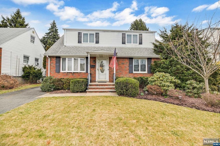 SPACIOUS EXPANDED HOME nestled on a quiet dead end street in the desirable Wallington East neighborhood--very close to the elementary, middle and high schools. Lovingly maintained by the same owner, this inviting space offers easy living & a great flow for entertaining including granite kitchen counters & breakfast bar peninsula. Enjoy relaxing evenings in the cozy family room featuring a floor-to-ceiling brick fireplace. Two sets of sliders lead to the roomy deck where you can relax in the peacefulness of your private yard. A generous bedroom w/huge WALK-IN CLOSET & modern full bathroom w/shower complete the first floor. HARDWOOD FLOORS below LR/DR carpet. Upstairs hosts 2 OVERSIZED bedrooms, abundant storage & a spacious full bath. Close to parks & convenient to NYC transit (Wesmont Station). Large basement provides unlimited possibilities. MULTIPLE ZONES of cooling & heating; Sprinkler System; ALARM SYSTEM. TRULY A SPECIAL HOME!