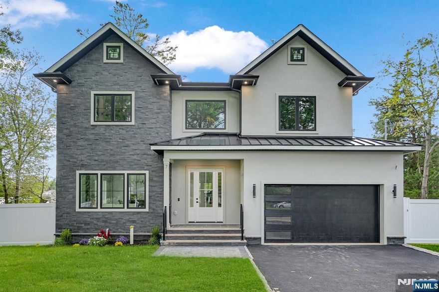 Welcome to this stunning NEW CONSTRUCTION 6 bed 5 bath home in a fabulous neighborhood in Short Hills located just minutes from the train station, vibrant downtown, & top-rated schools. Step into a 2-story foyer that sets the tone for the luminous interiors, filled with abundant natural light and gorgeous designer finishes throughout. The open concept living and dining rooms provide a refined backdrop for entertaining, while the gourmet chef's kitchen is a true showpiece, boasting custom cabinetry, high-end appliances including a beverage fridge and a custom pantry closet. The kitchen flows seamlessly into the stunning family room, anchored by a striking stone-clad fireplace & sliders leading to the FLAT backyard. A convenient 1st-floor guest ensuite & custom mudroom complete this level. Upstairs, retreat to the gorgeous Primary Suite, featuring 2 large walk-in closets & a spa-inspired bath w/ soaking tub, dual vanities & glass-enclosed stall shower. A Junior Ensuite, 2 additional bedrooms sharing a gorgeous hall bath & an upstairs laundry room complete the level. The fully finished lower level incld. spacious recreation room w/ wet bar, a guest bedroom with WIC & full bath, plus abundant storage. Outdoors, enjoy a FENCED-IN side and backyard, perfect for leisure, play, and entertaining. Backed by a 10-year builder's warranty, this residence offers the ultimate blend of luxury, location, and peace of mind.