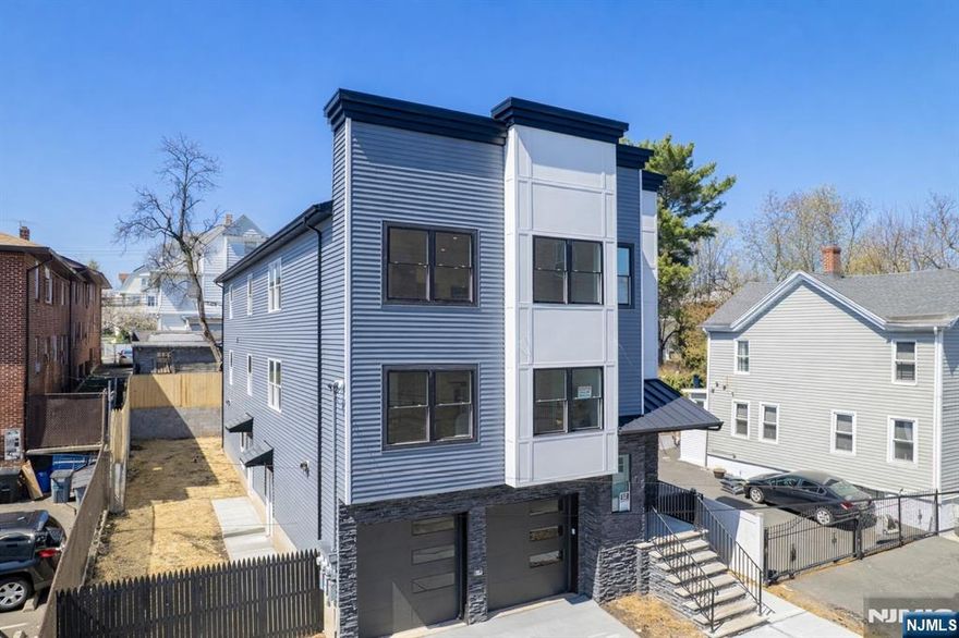 You found your dream home! Introducing a newly constructed two-family home in Irvingtonâ€”an exceptional opportunity for both owner-occupants and investors. Each unit features 4 spacious bedrooms and 2 full baths, including a primary suite with private bath and walk-in closet. Enjoy open-concept living and dining areas filled with natural light, and modern kitchens with quartz countertops and stainless steel appliances (stove, microwave, dishwasher). The finished lower level offers flexible bonus space ideal for a recreation room, home office, gym, or media area, plus a full bath, laundry area, and access to an oversized 2-car garage. Additional features include washer/dryer hookups on each floor and generous living space throughout. 5 year tax abatement benefit applies. Conveniently located near parks, restaurants, shopping and NYC transportation.