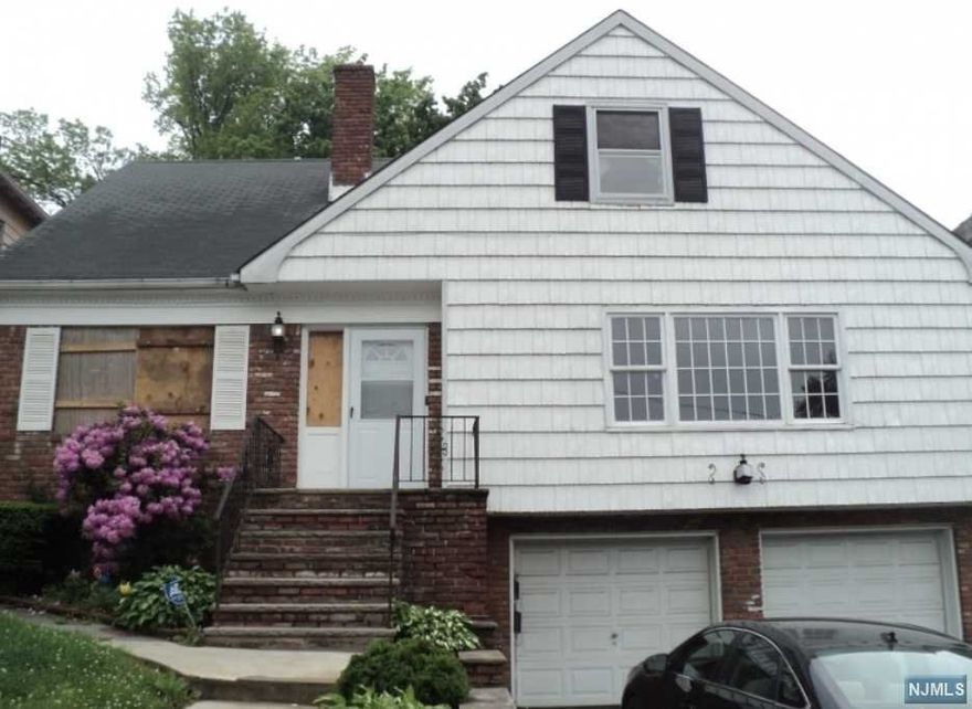 Very large 2 family, large rooms and plenty of parking. This is an REO property being sold in "as is" condition. Large rooms, Lots of storage. Bring your ideas and your skilled labor and turn this house into a palace! Great curb appeal!