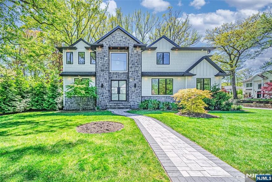 Stunning East Hill colonial built in 2021 by a prominent builder, offering exceptional curb appeal and a prime Tenafly location. The double-height entry foyer leads to spacious formal living and dining rooms, a sunlit family room with fireplace, and a chefâ€™s kitchen with premium finishes. Main floor features a mudroom, 2-car garage, guest bedroom, and full bath. Upstairs boasts a luxurious primary suite with walk-in closet and spa-like bath, a Jack & Jill bedroom suite, and an additional en suite bedroomâ€”all with soaring ceilings and generous closets. The fully finished lower level includes a legal bedroom, full bath, large recreation area, home theater, gym, and ample storage. Close to houses of worship, express bus, and downtown. Donâ€™t miss this incredible opportunity!