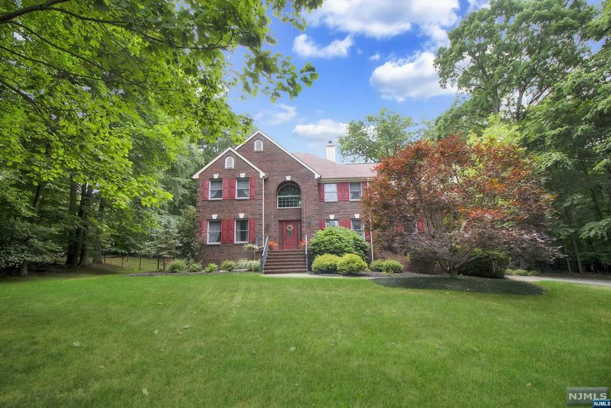 Nestled on America's quintessential tree-lined street, this spacious colonial home offers suburban luxury living. A grand 2-story entry welcomes you w/gleaming HW floors and a Palladium Window flooding the space with light. The open floor plan, w/newly finished HWF, is perfect for entertaining. The living room transitions into the family room with a wood-burning fireplace and French doors. The updated Eat-In Kitchen is a culinary haven with newer SS appliances, granite CT, and access to a deck overlooking the landscaped backyard with a custom pool and spa. The first floor is completed W/a DR, 2 powder rooms, laundry room, and garage access. Upstairs, the main BR has a fireplace, sitting area, and spa-like bath w/ a soaking tub and dual WIC. 3 well-sized bedrooms and a full bath complete the upper level. The full, recently renovated, basement two offices/dens, a rec. room, and ample storage. New septic installed March 2024.